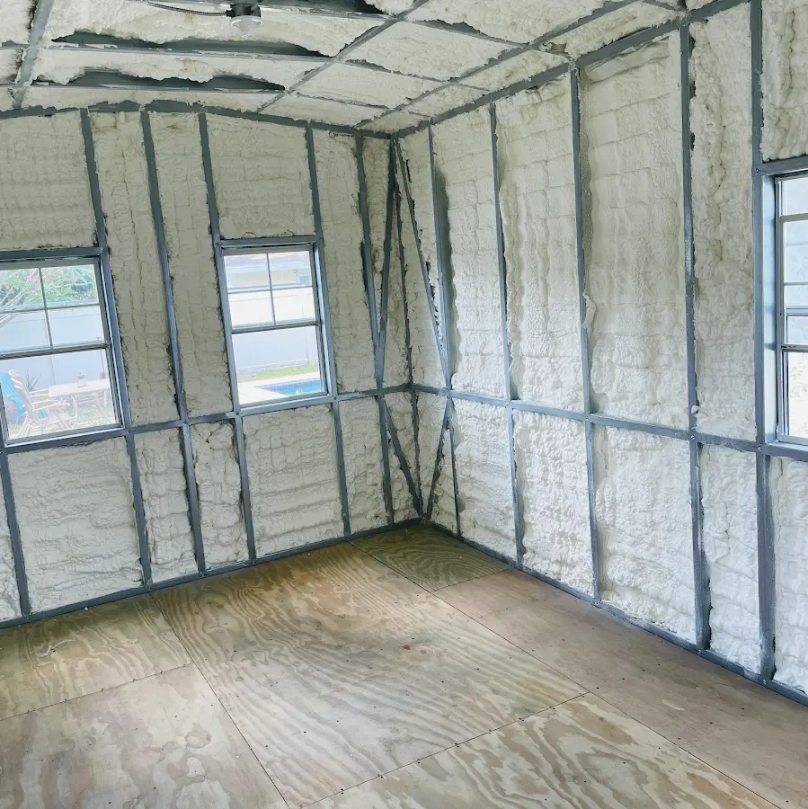 Closed-cell spray foam insulation applied to wall cavities in a residential project in Plano